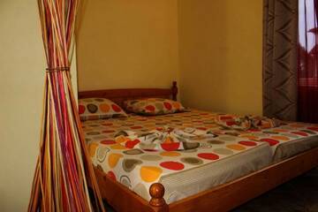 Фото номера Семейный номер с видом на сад Гостевой дом Guest Rooms Cveti г. Кранево 4